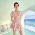 Women's two-piece swimwear set with matching top and skirt in solid colour