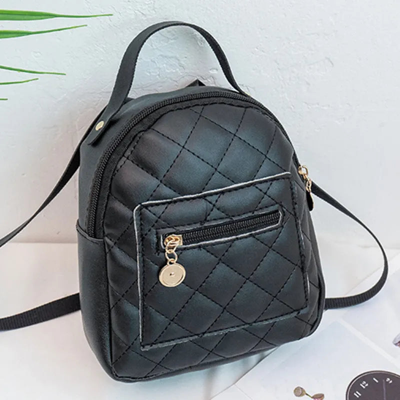 Girls' hard square PU backpack with embroidery in pink, showing front sandwich pocket and carry handle.