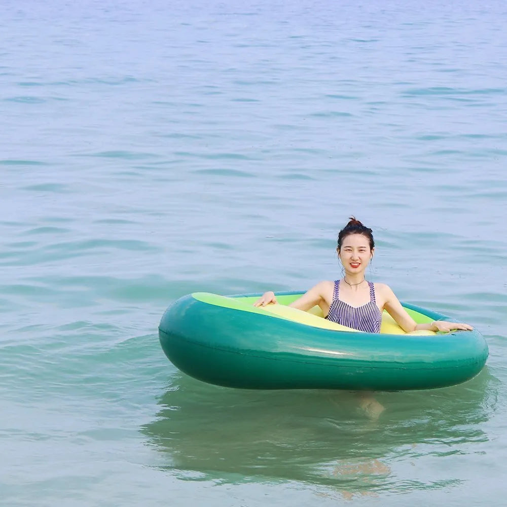 Large green inflatable avocado-shaped pool float measuring 169cm long