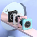 Alloy-case portable power bank with digital clock display in mint green, showing its multi-U port and compact size.