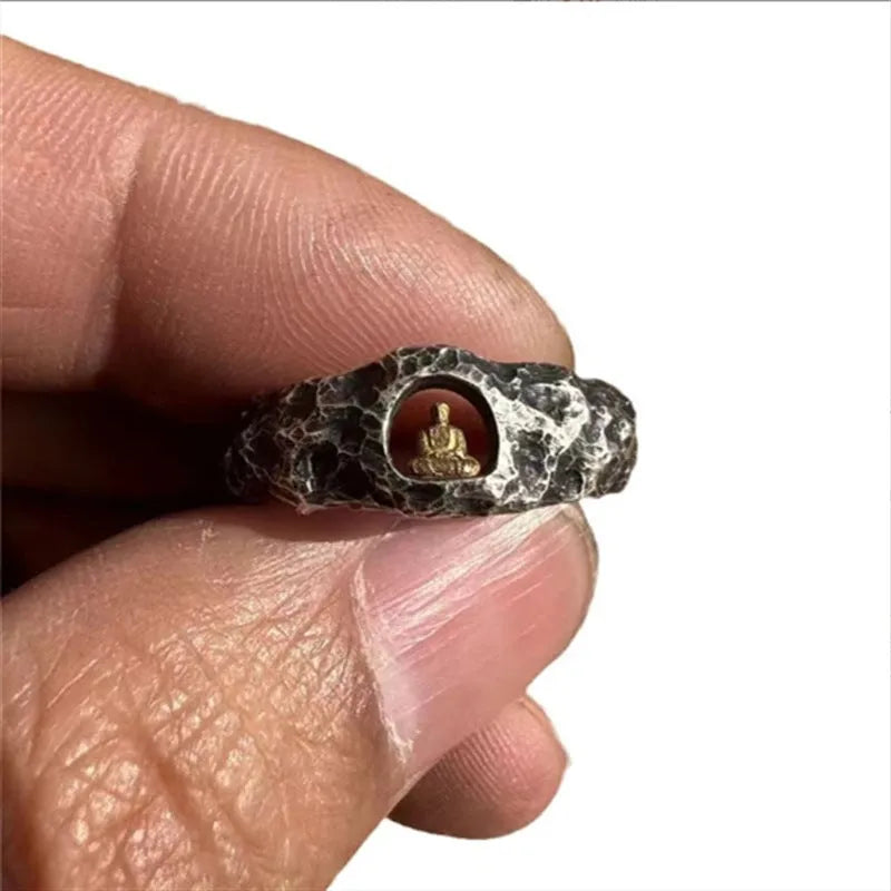 Hand-forged copper Grotto Buddha ring with a rock texture band.
