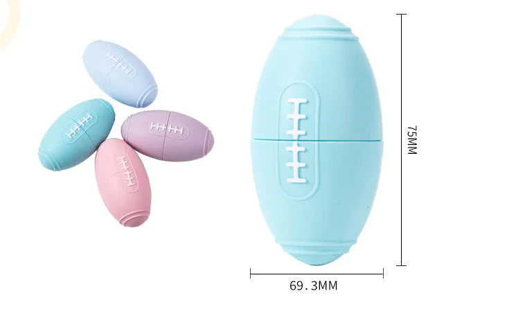 Blue silicone rugby ball dog chew toy with multiple small food leak holes on a white background.