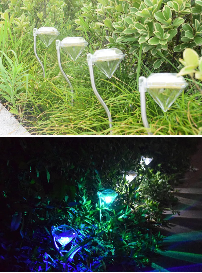White solar-powered diamond-shaped garden light with adjustable angle and solar panel on top.