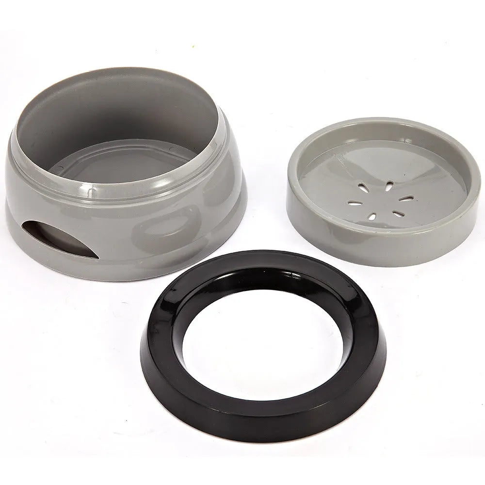 Floating no-spill pet bowl in ABS plastic, 15.3x18.9x8cm, shown in grey, green, pink or blue