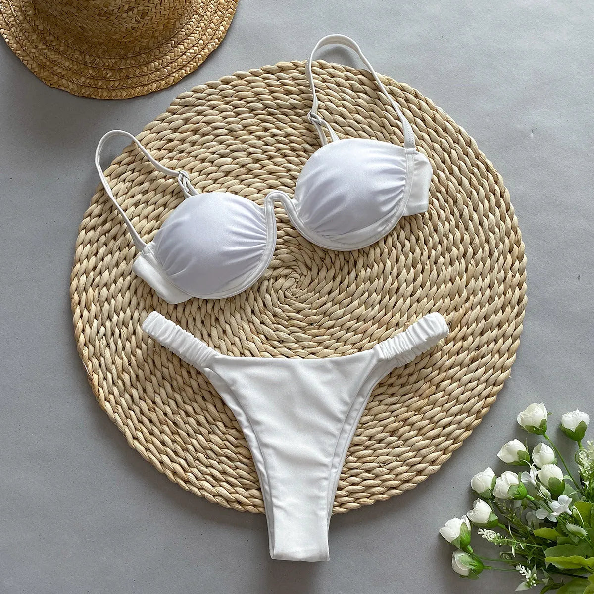 Women's khaki underwire bikini swimsuit with split briefs on a white background.
