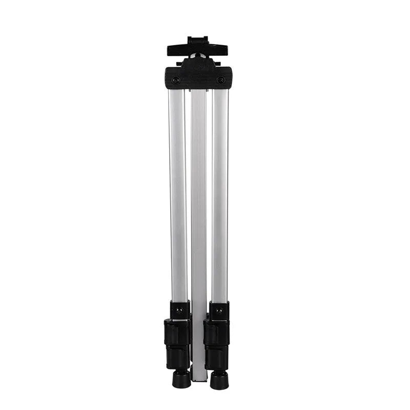 Silver aluminium alloy adjustable easel with metal tray in collapsed position on a tabletop