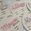 Square wooden baby name label displaying birth information with 15cm dimensions