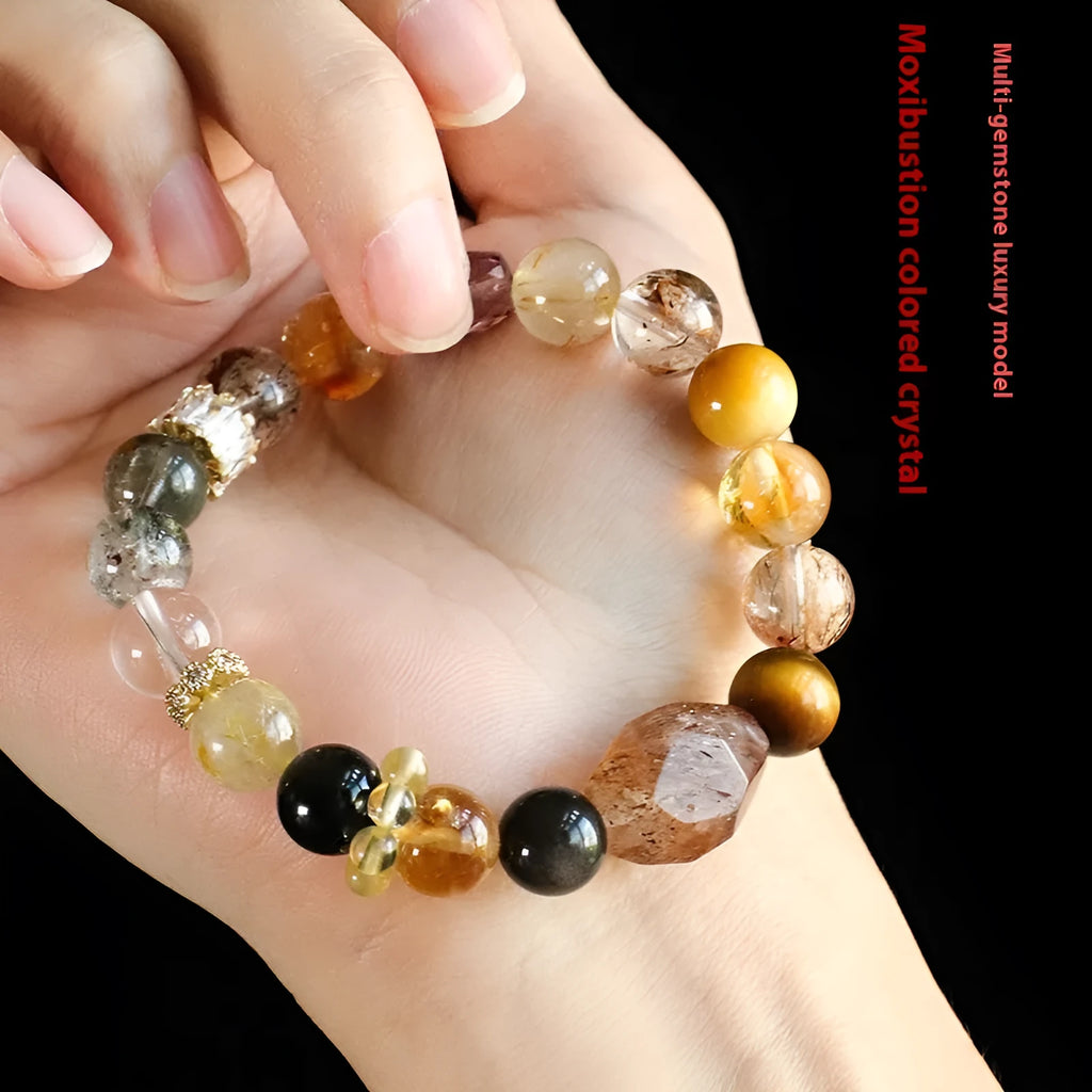 Natural Duobao crystal bead bracelet with black and gold beads on a woman's wrist.