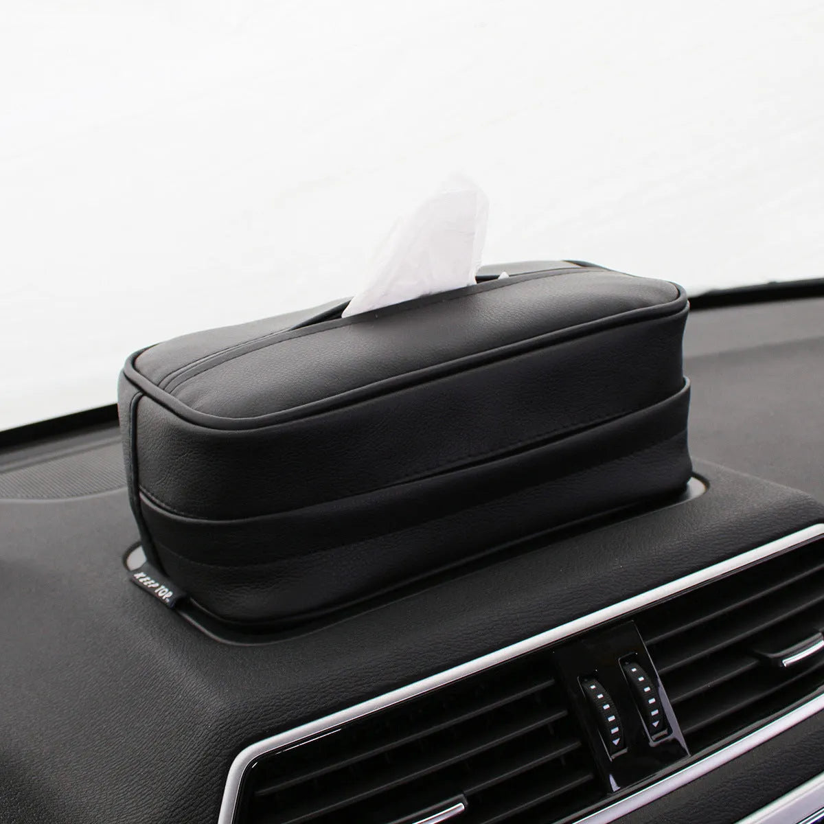 Beige PU leather car hanging organiser box with a loop, shown next to a black medium and black large size option.