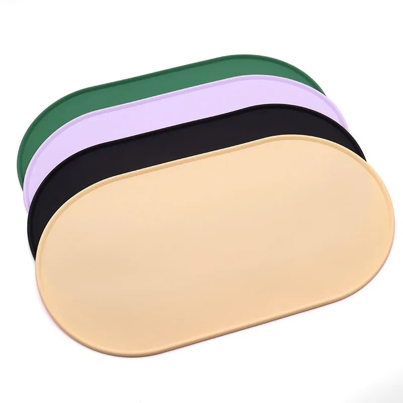 Green silicone waterproof cat feeding placemat with food bowl on it, showing non-slip textured surface.