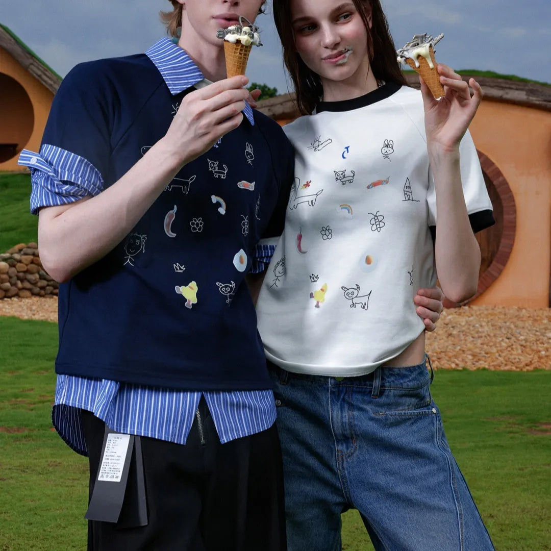 Men's blue loose fit short sleeve shirt with a cartoon print design on the front.