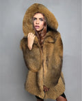 A woman wearing a silver grey loose-fit mid-length artificial fur coat.