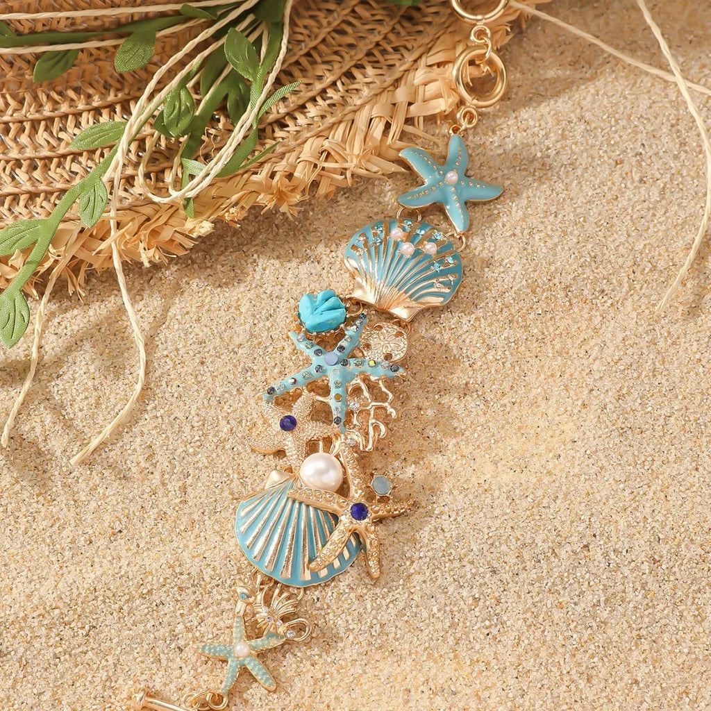 Women's alloy rhinestone bracelet with marine anchor, shell, star, and starfish motifs in blue, red, or turquoise.