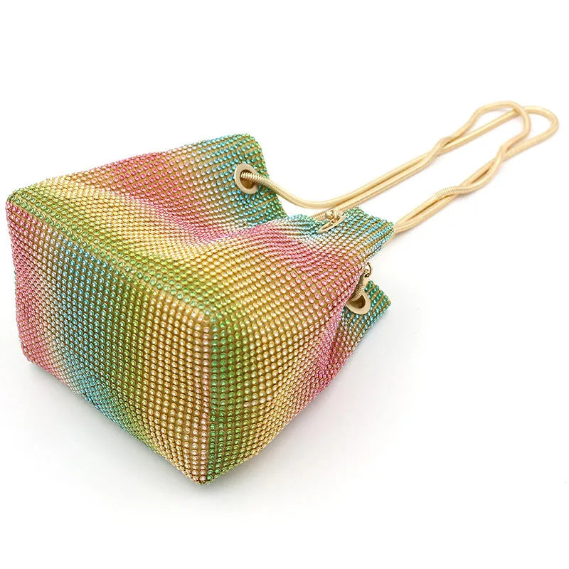 Colourful rhinestone bucket bag with sparkly fabric, shown as a handbag and shoulder bag.