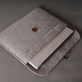Grey felt laptop sleeve compatible with MacBook Air and Pro 13 to 16 inches