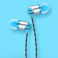 Black wired in-ear headphones with microphone on cable and silicone eartips next to a 3.5mm plug.