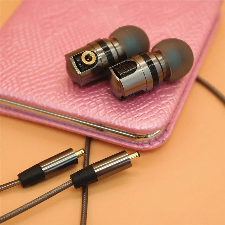 Titanium grey metal in-ear earphones with a detachable TPE cable and aluminium foil shielding.