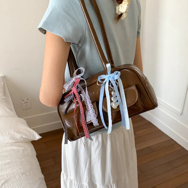 Niche single shoulder bag for women in PU pillow shape, showing internal pockets and available colour options