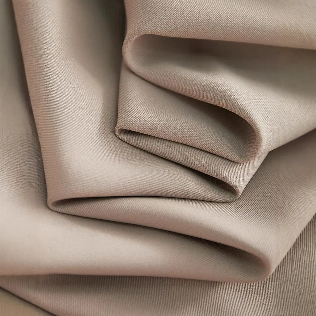 Wide-leg women's trousers in milk apricot with stacked hem design and pockets, flat lay view