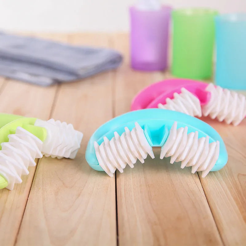 Handheld anti cellulite massager roller with blue dot wheel on white background, 13.5x8.5cm