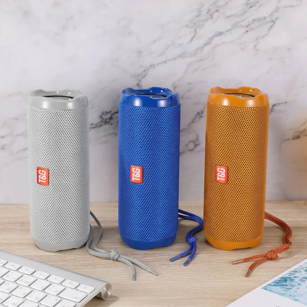 Fabric-covered portable Bluetooth speaker with a visible card holder slot in a choice of colours.