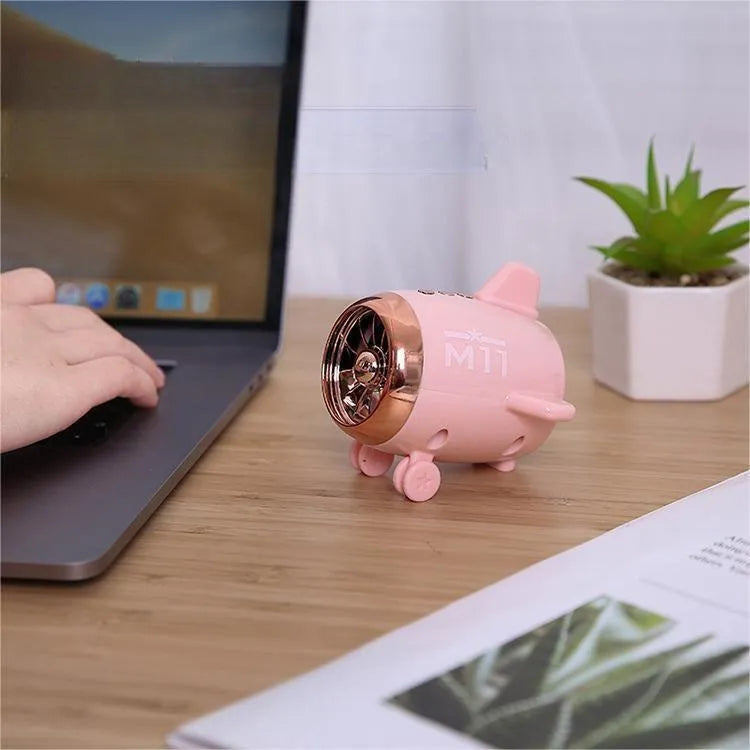 Mini Bluetooth wireless speaker in multiple colour options showing compact size