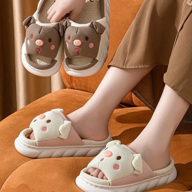 Pair of open-toe linen flip-flop slippers for couples on a plain background, showing colours and strap detail.
