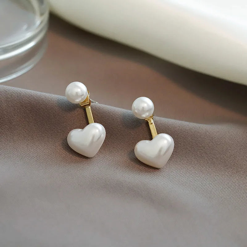 Women's heart-shaped pearl stud earrings with electroplated alloy construction and artificial gemstone details