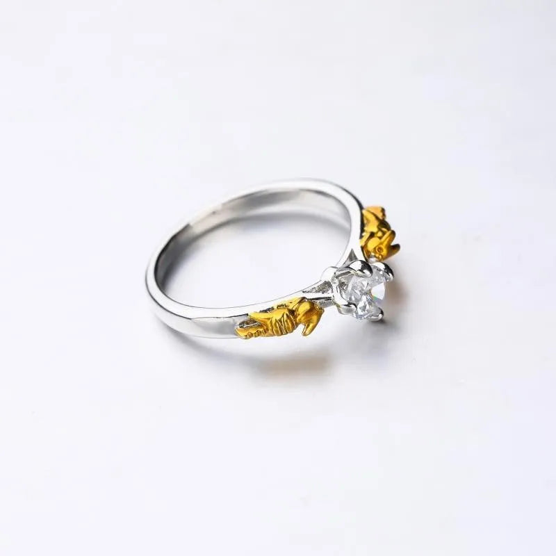 Copper crown fashion ring with black gold finish on a hand.