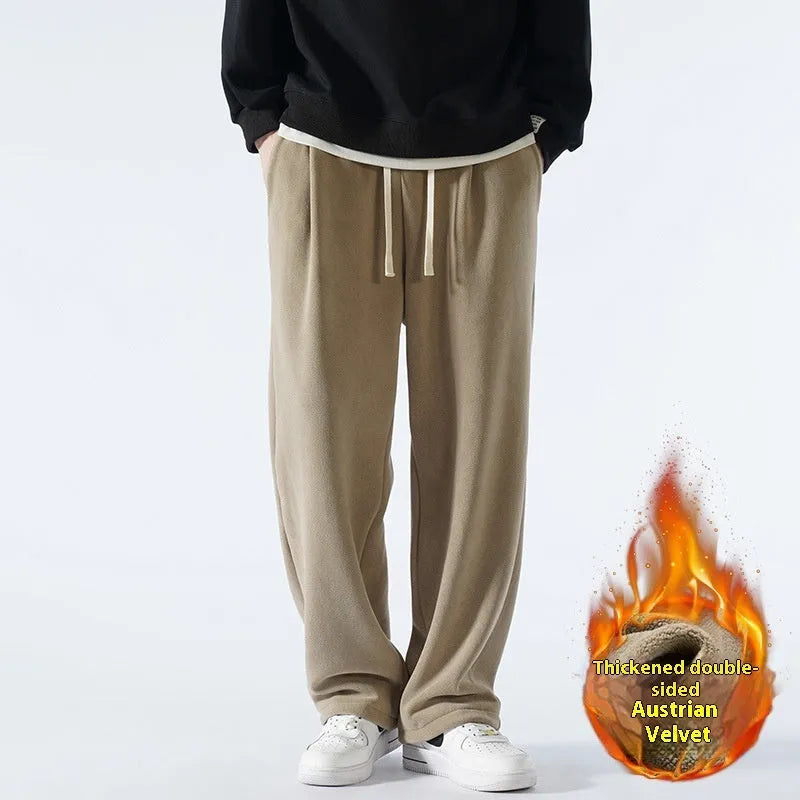 Men's apricot coloured loose-fit polar fleece-lined casual winter trousers on a white background.