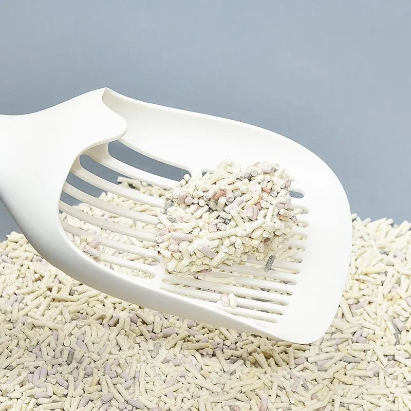 White plastic cat litter scoop with a self-cleaning base on a white background.