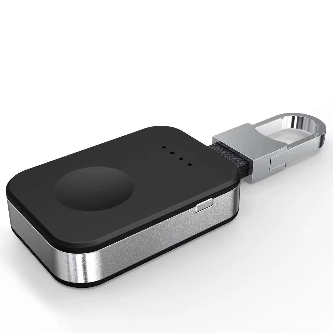 Black Apple Watch portable power bank keychain charger on a keyring.