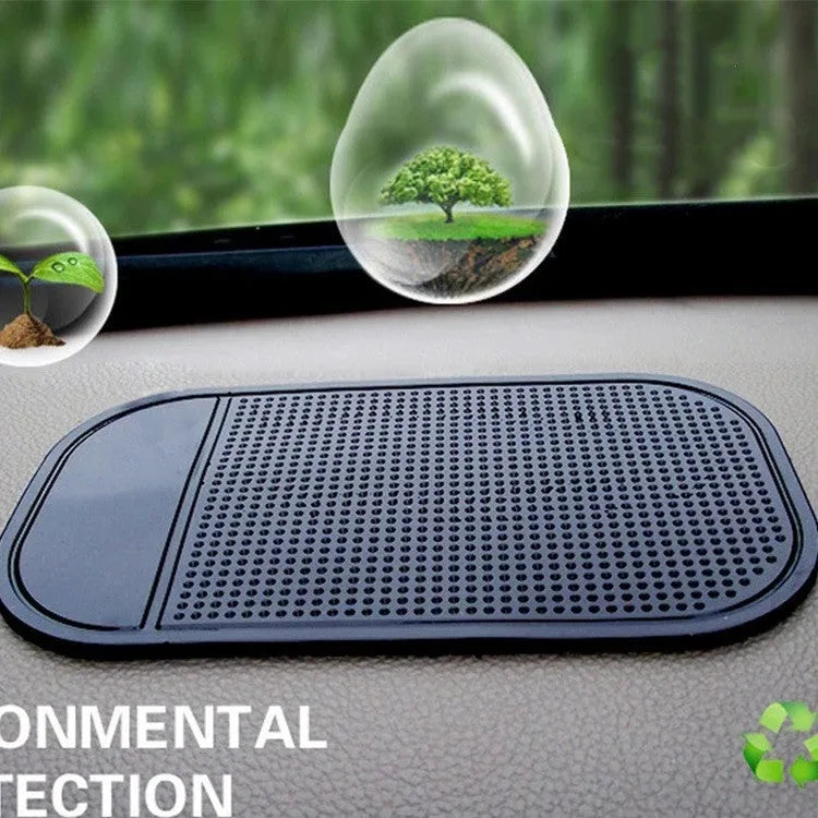 Black silicone spider anti slip mat for car dashboard measuring 13 by 7 centimetres