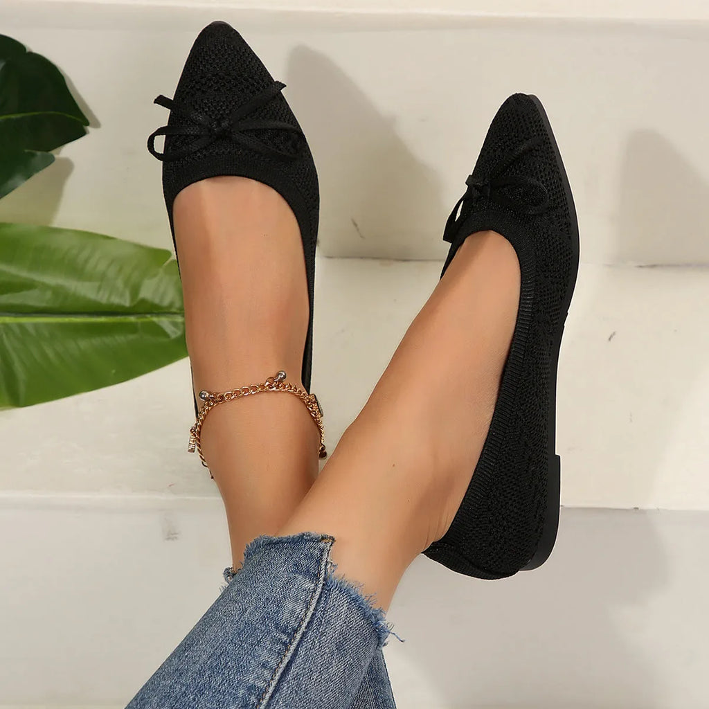 Women's knitted flat shoes with a pointed toe and decorative bow, shown in multiple colour options.