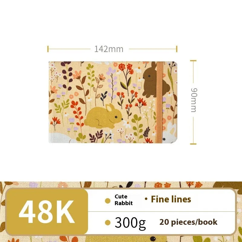 Fabric-bound handmade watercolour notebook with artistic cover design for character sketching