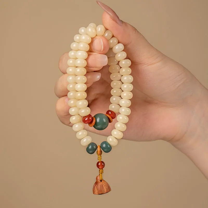 Wooden milk butter Bodhi root bracelet with 6x9mm flat round beads on wrist