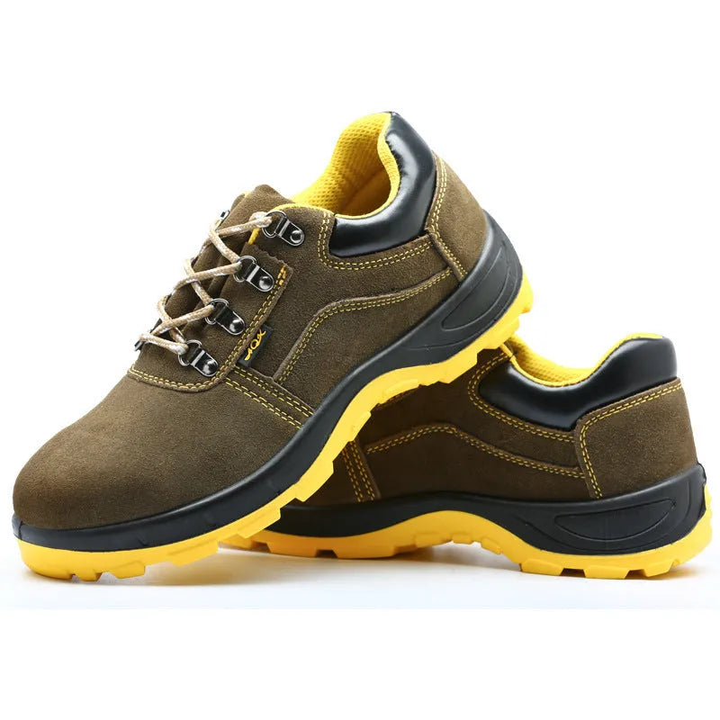 Bronze coloured low-cut cow suede leather safety shoes with a steel toe cap on a work surface.