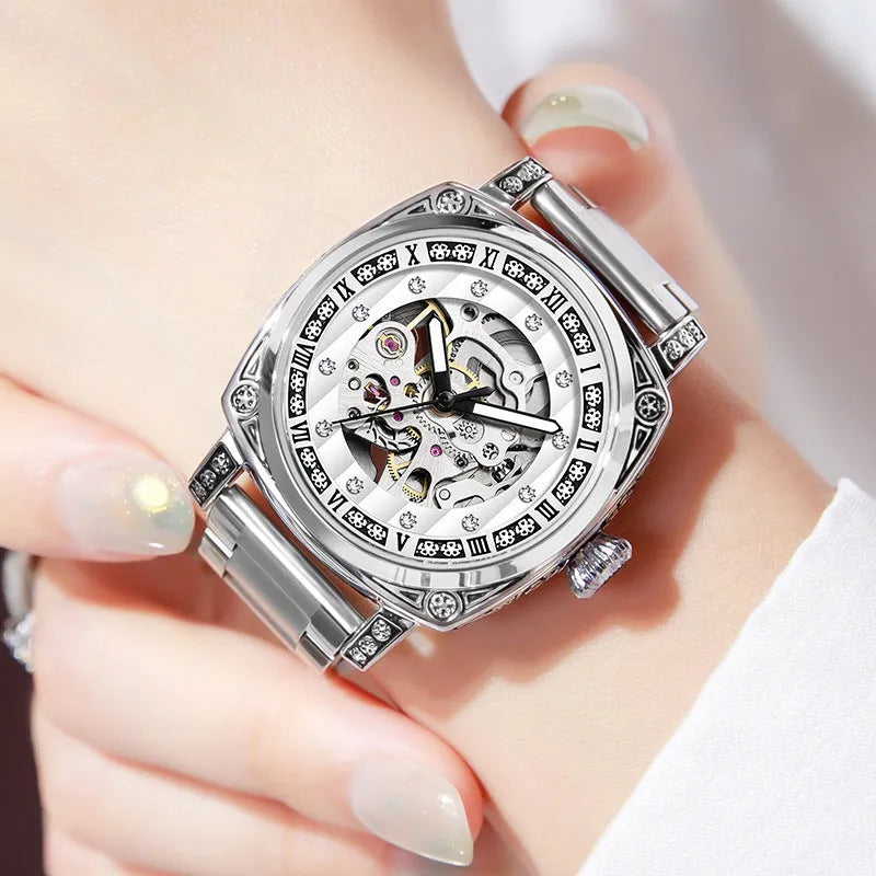Mechanical wristwatch with luminous hands and a leather strap, shown in a choice of colours.