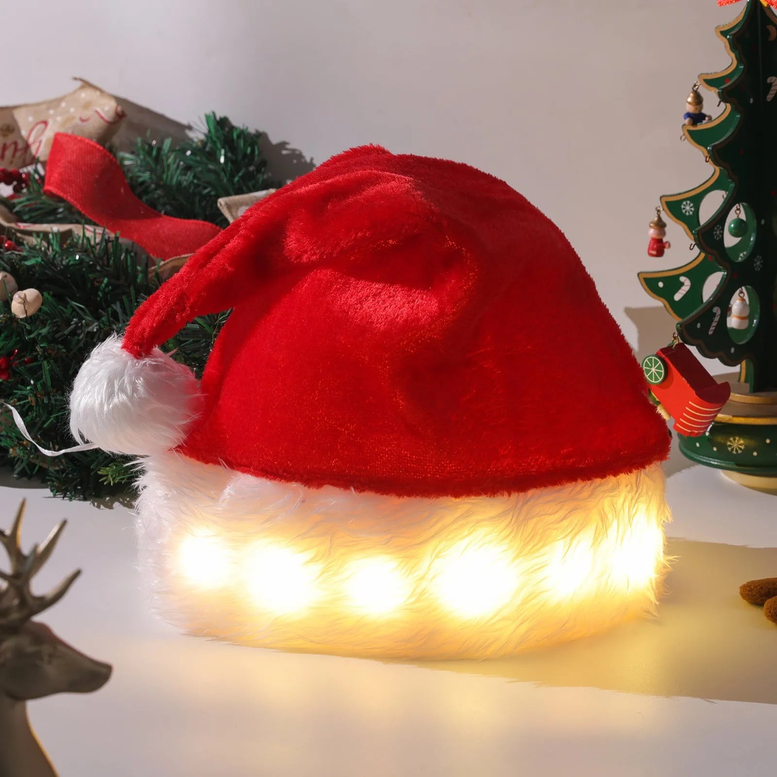 Red and white plush Santa hat with LED lights glowing around the rim and a white pom-pom.
