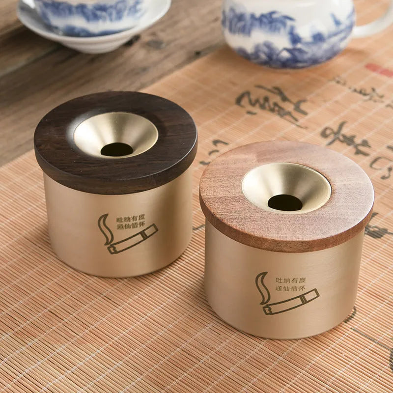 Retro brass ashtray with wooden lid showing centre hole design