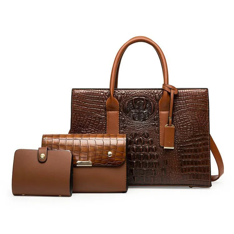 Women's three-piece PU leather handbag set with crocodile pattern in four colour options showing interior zippered compartment