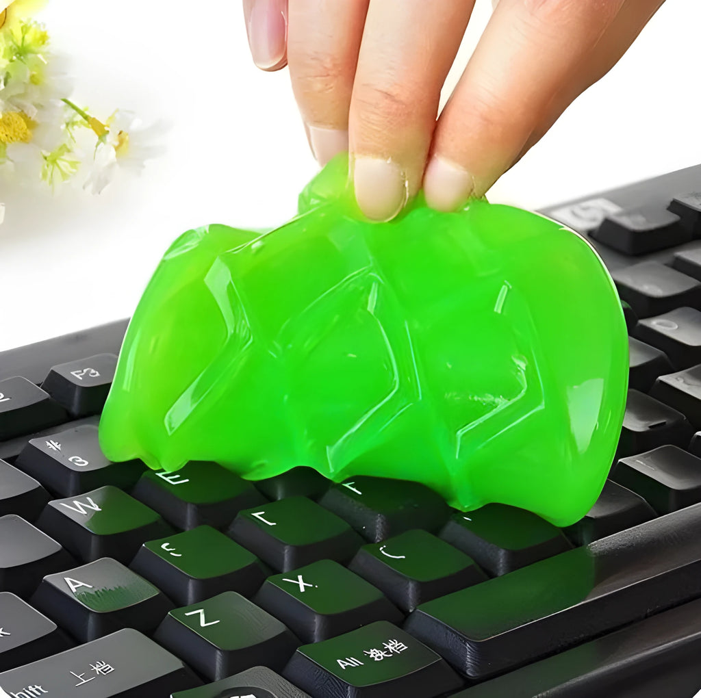 Blue and yellow magic cleaning gel putty for dust removal on a keyboard