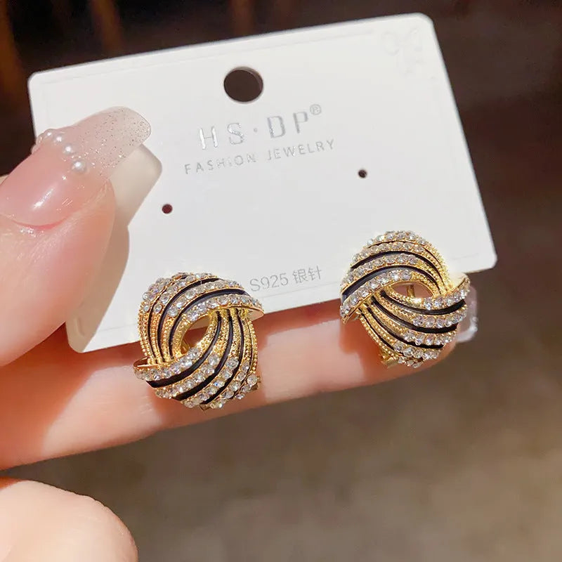 Super-flashing rhinestone ear studs with geometric ring shape and real gold plating on copper