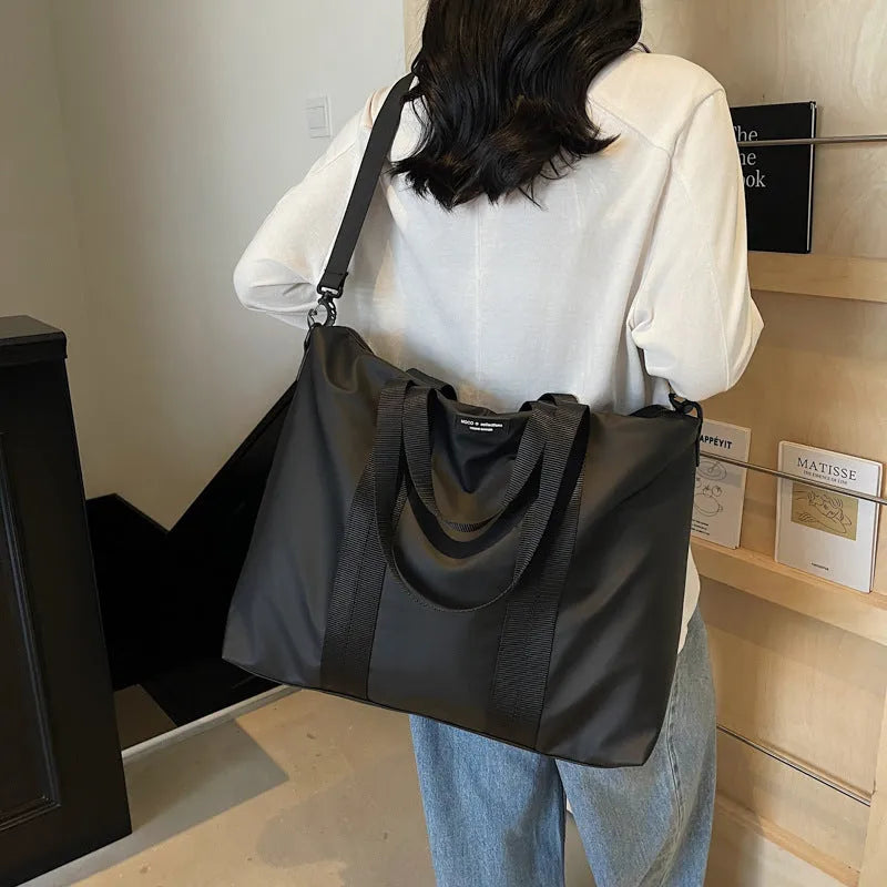 Lightweight Oxford cloth travel tote bag in black, grey, or champagne colour