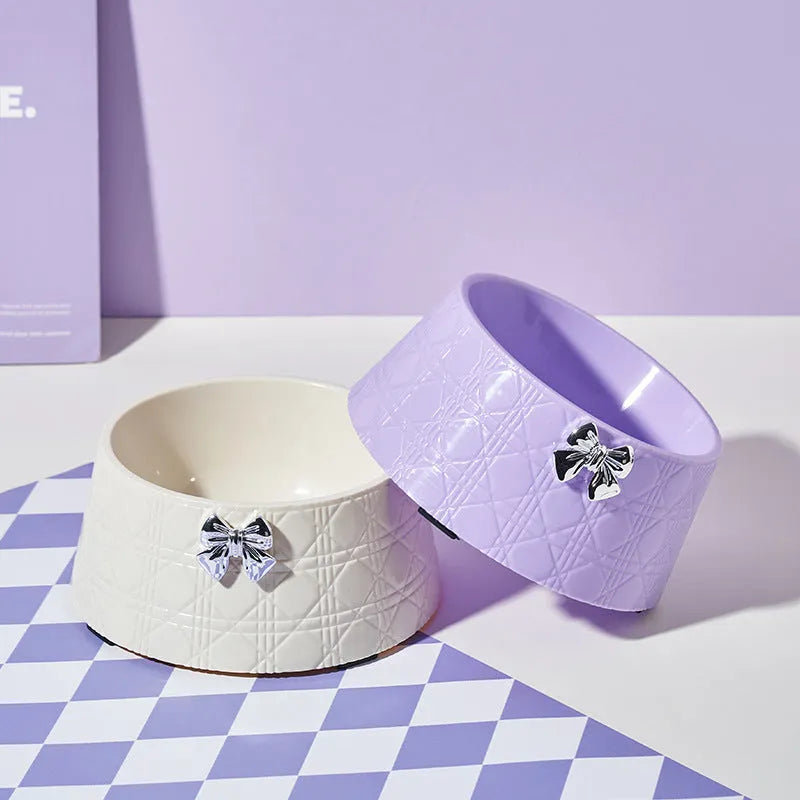 Pet food bowl with diamond pattern and a decorative bow design in a choice of colours.
