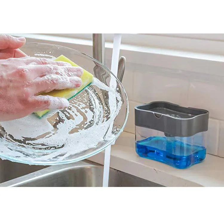 A grey plastic soap dispenser with a pump, sitting on a kitchen countertop.