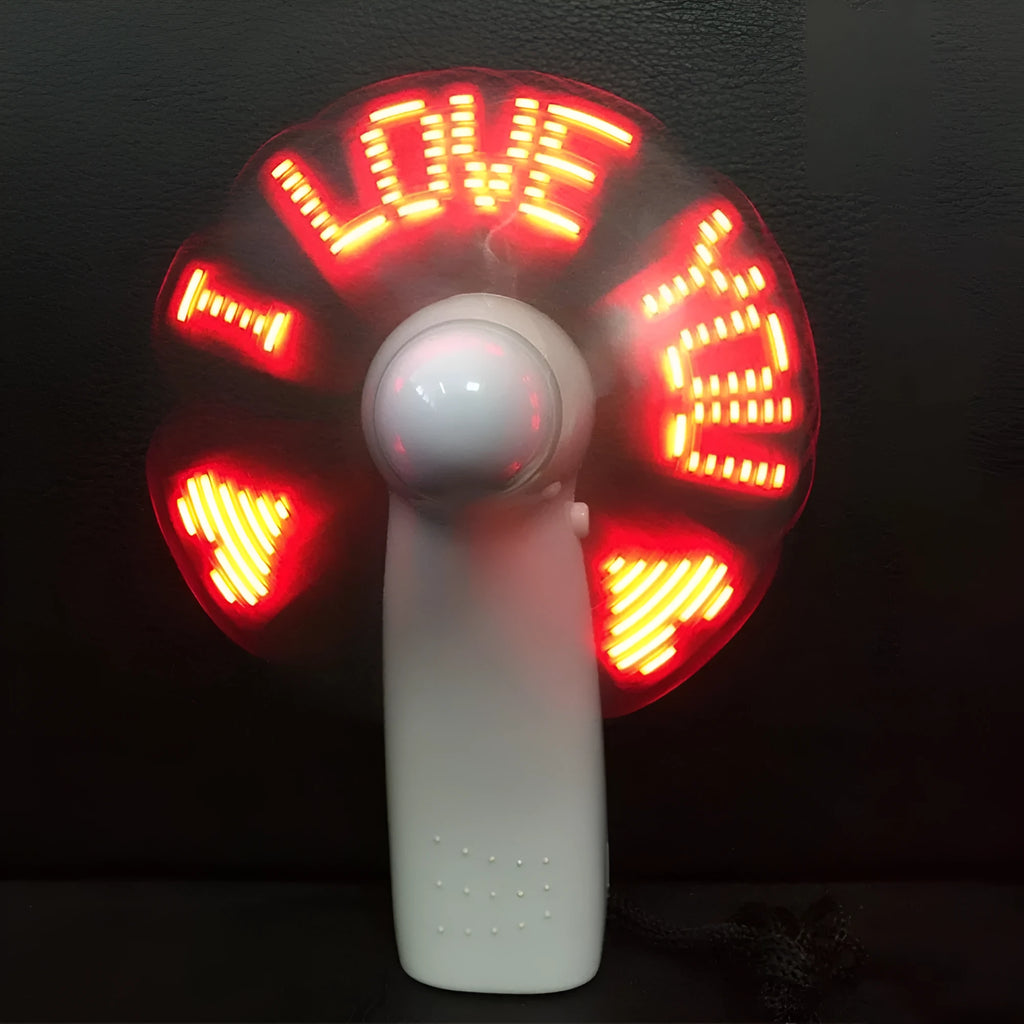 White handheld mini fan with blue and red LED lights flashing 'I Love You' pattern.