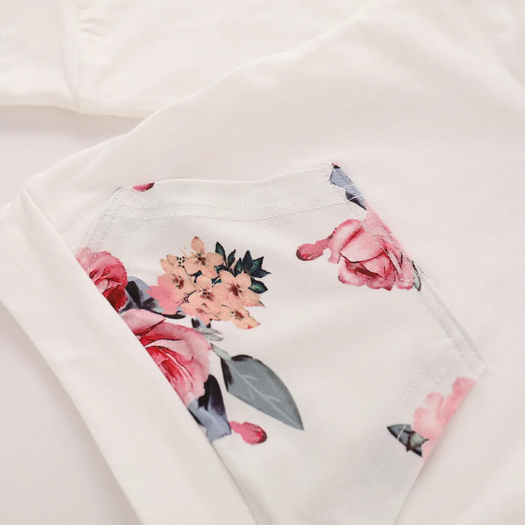 White 100% cotton hooded playsuit for a baby, showing long sleeves, trousers, and pullover neck.
