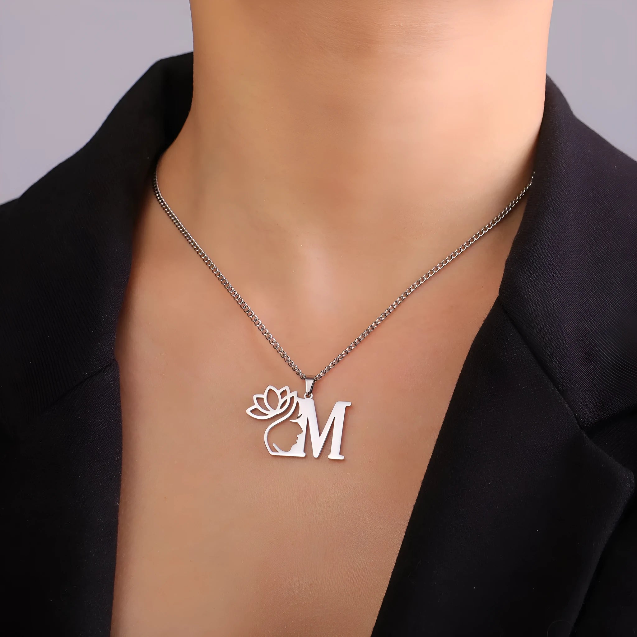 Women's stainless steel necklace with cross chain and a single letter pendant in gold or silver tone.