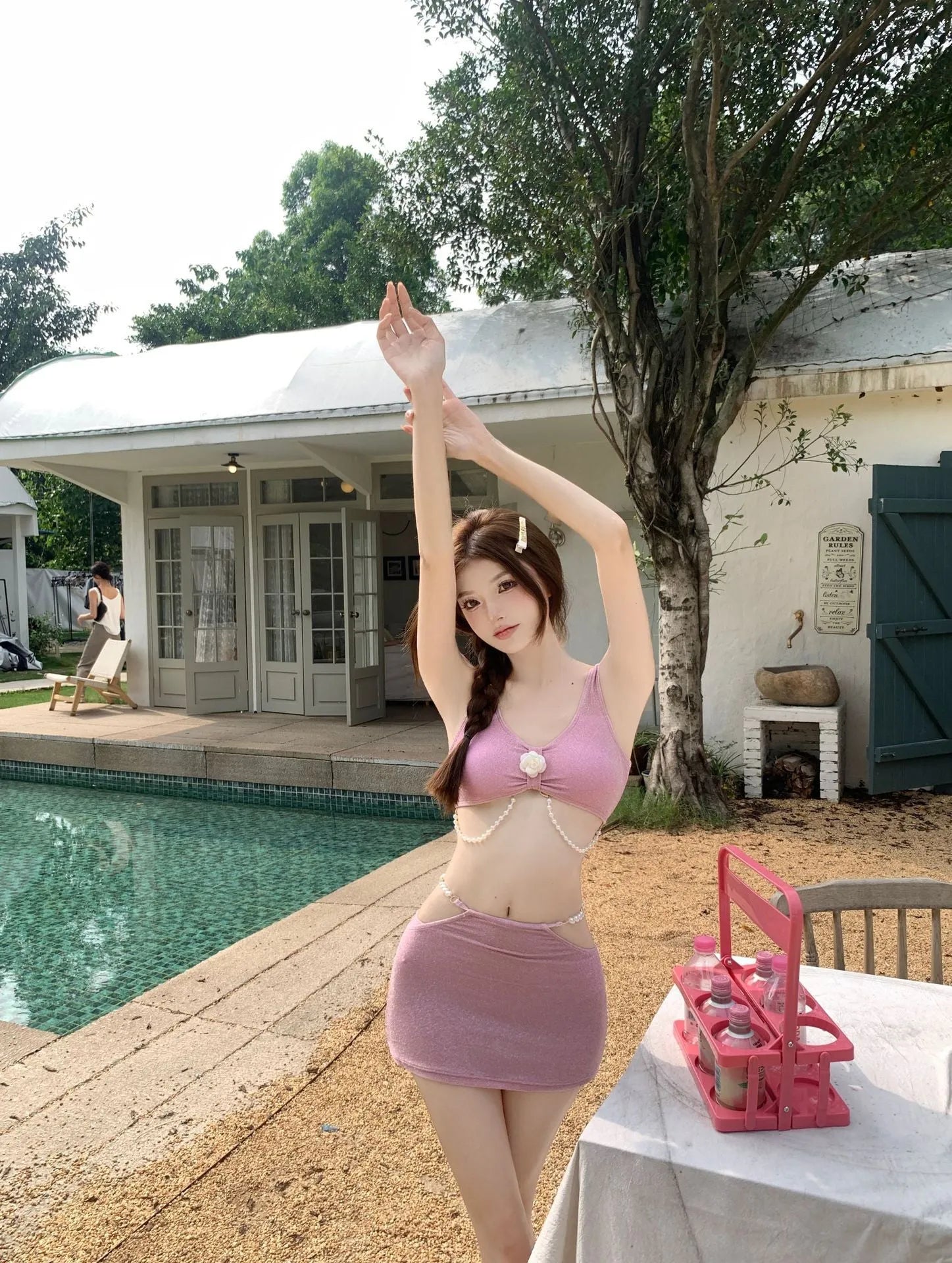 Black and pink women's three-piece polyester bikini set for swimming, shown in Asian sizes S to XL.